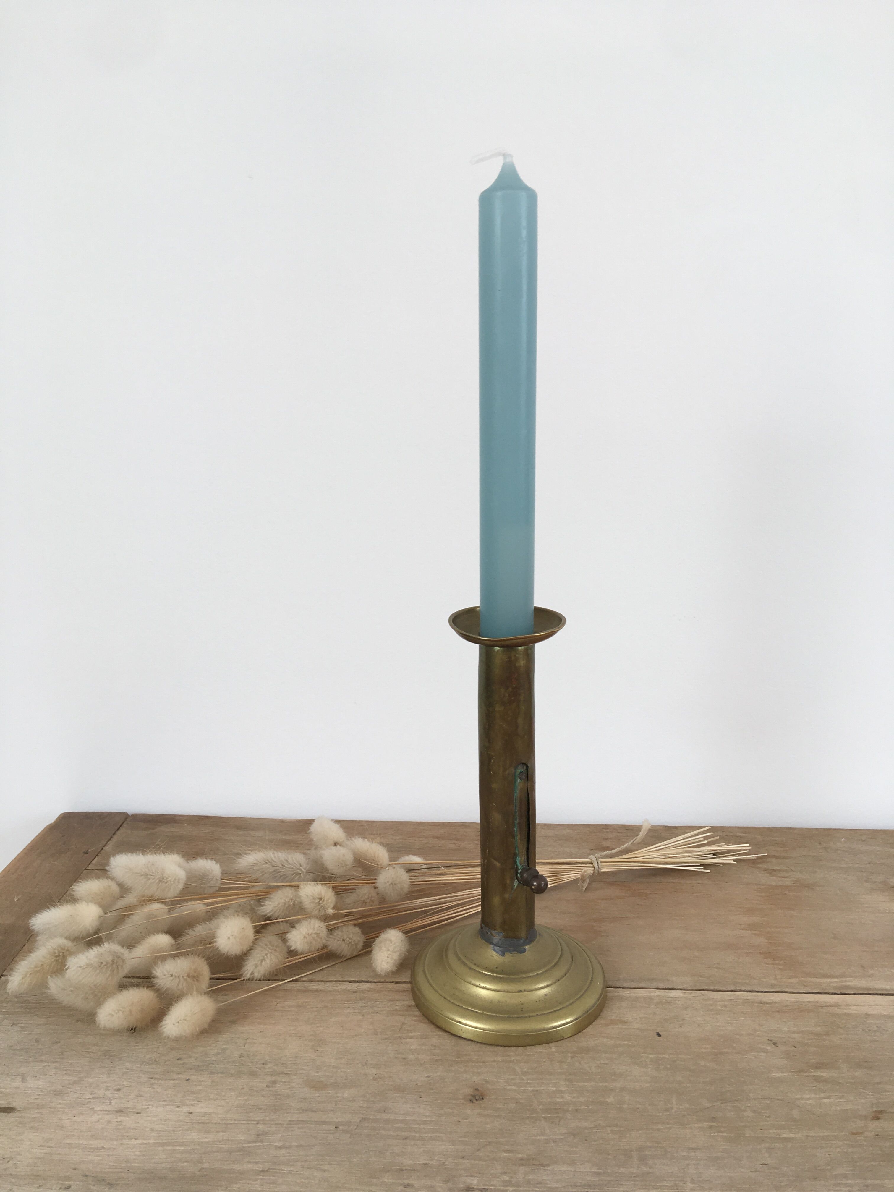 Brass pusher candle holder