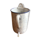 Fountain in old enamelled sheet metal