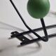 Vintage wall coat rack in black metal and wood, Roger Féraud style from the 1960s.