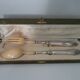 Silver salad servers stuffed in its case