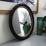 black and gold oval mirror