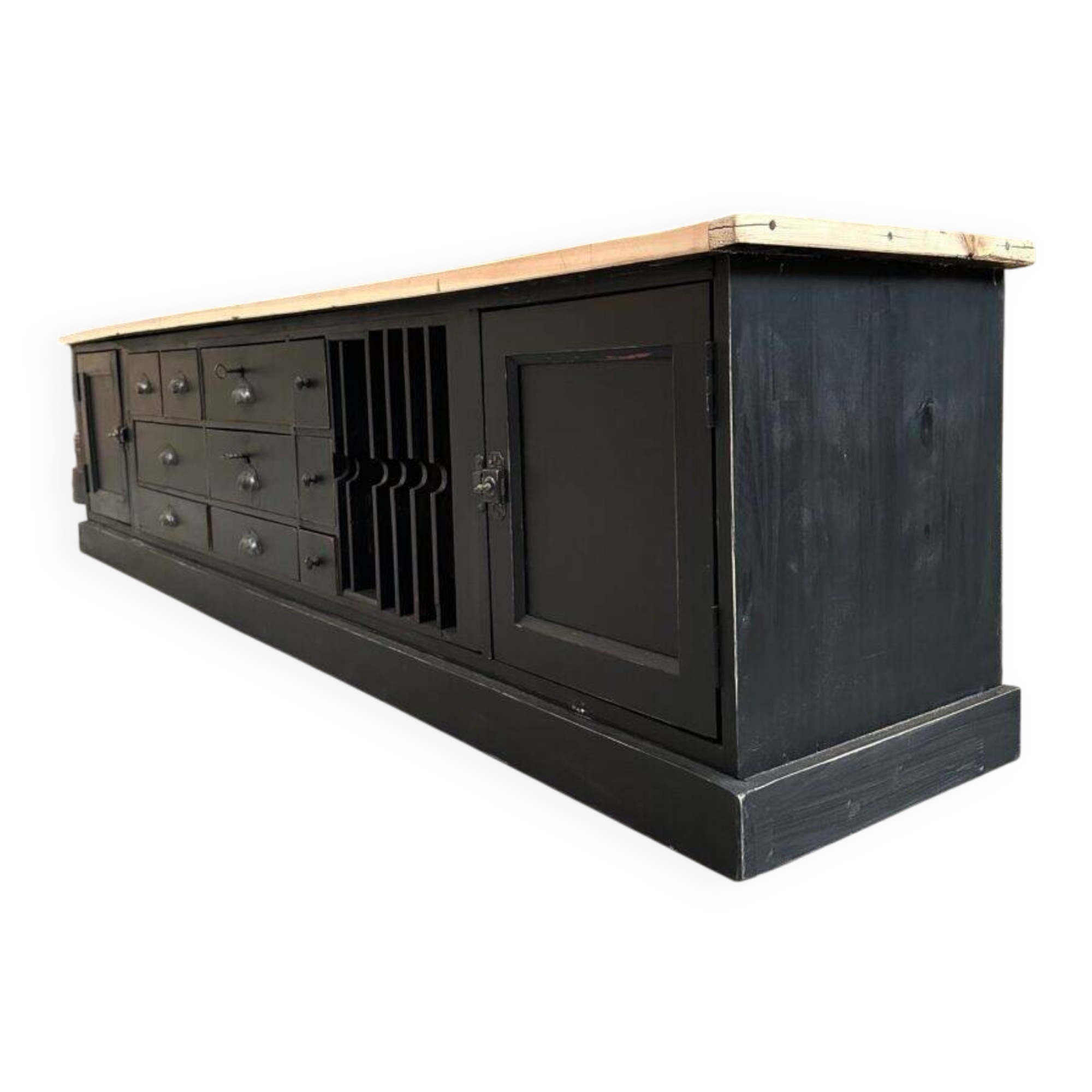 Old workshop furniture transformed into a TV unit.