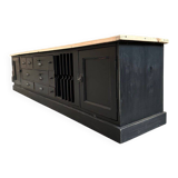 Old workshop furniture transformed into a TV unit.