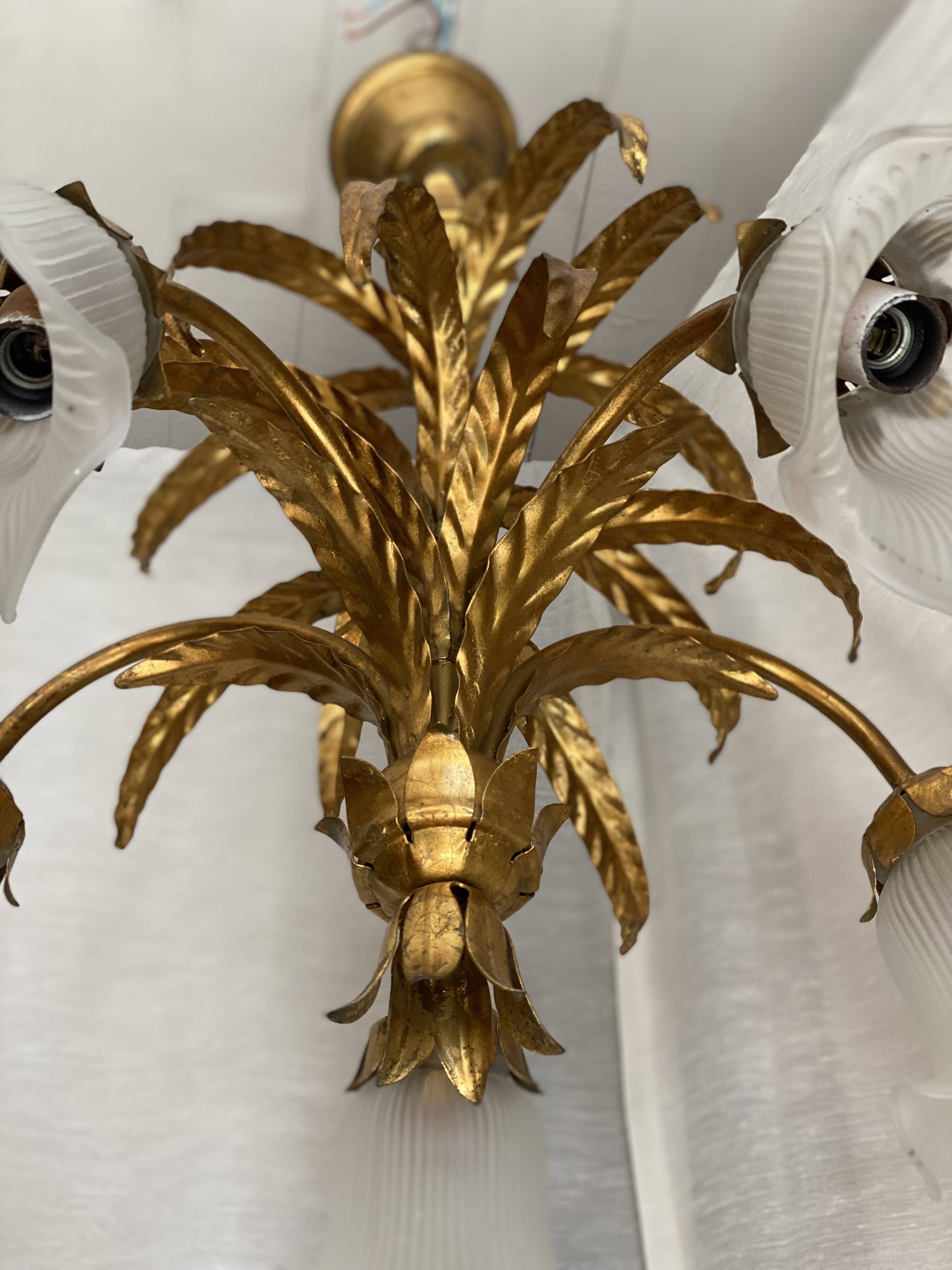 Vintage 1970s golden metal palm chandelier in the style of JANSEN.