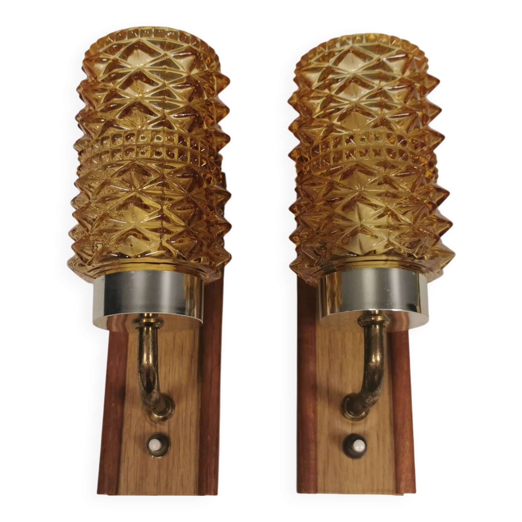 A set of wall lamps in teak wood, with amber colored glass