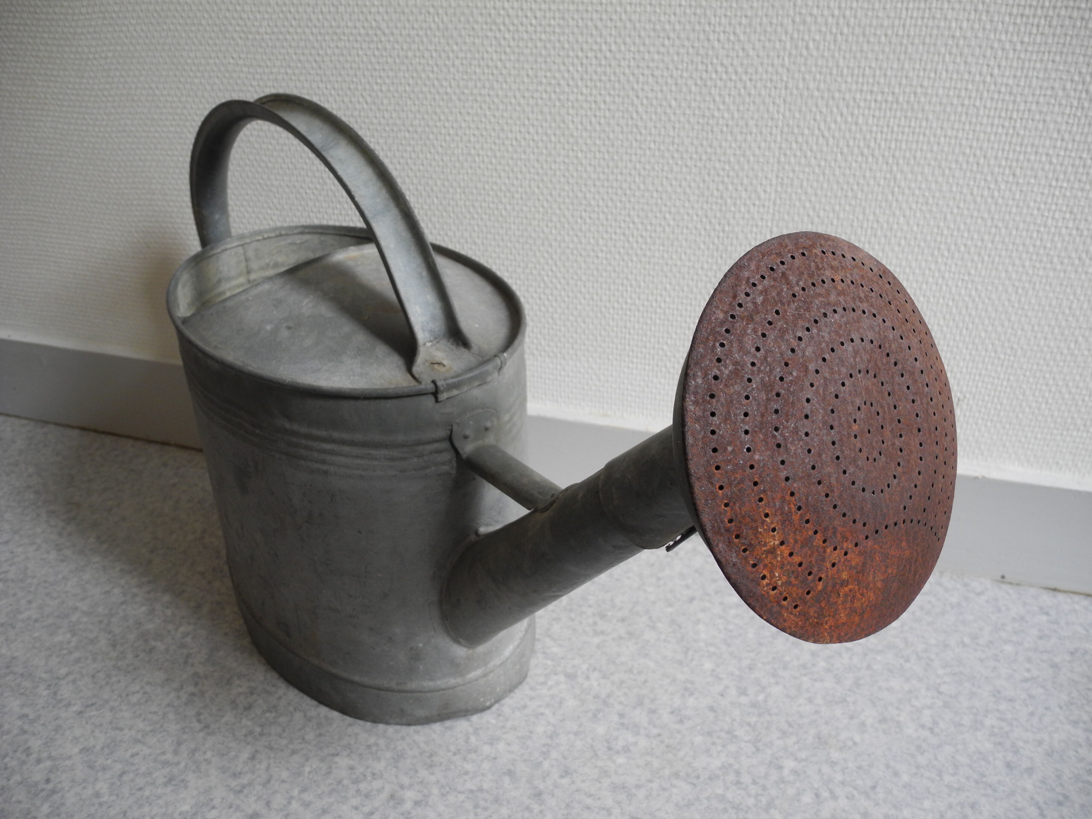 old zinc deco watering can