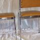 Pair of modernist chairs in chromed metal and imitation leather