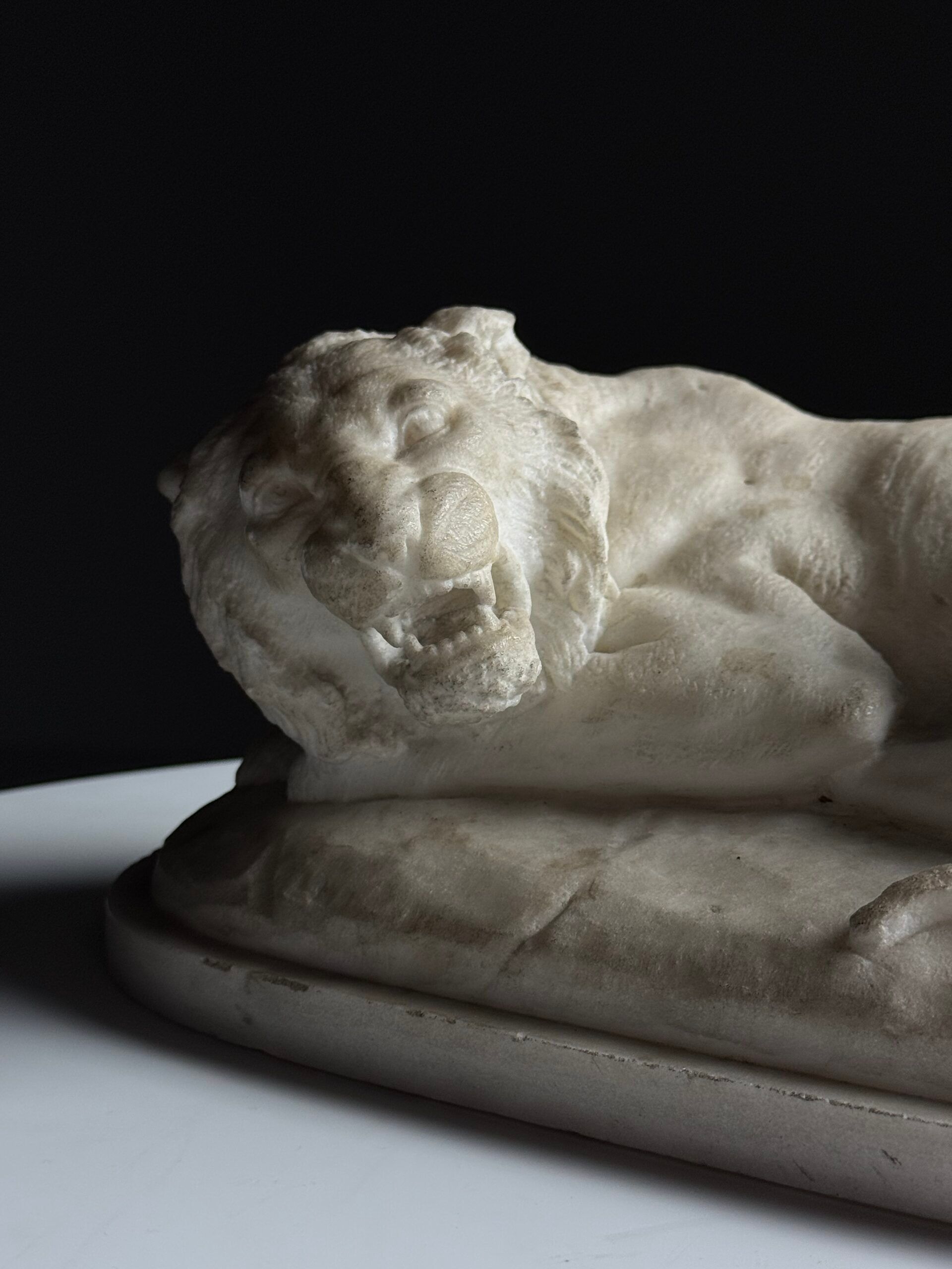 Marble sculpture of a reclining lion