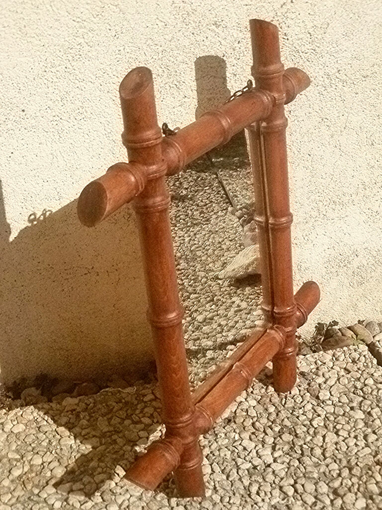 Old wooden mirror, carved bamboo way