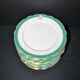 Paris porcelain set of 12 flat plates with green border and gold monogram JC.