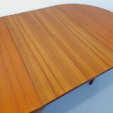 Large vintage Scandinavian round table from the 50s 60s in teak with extensions