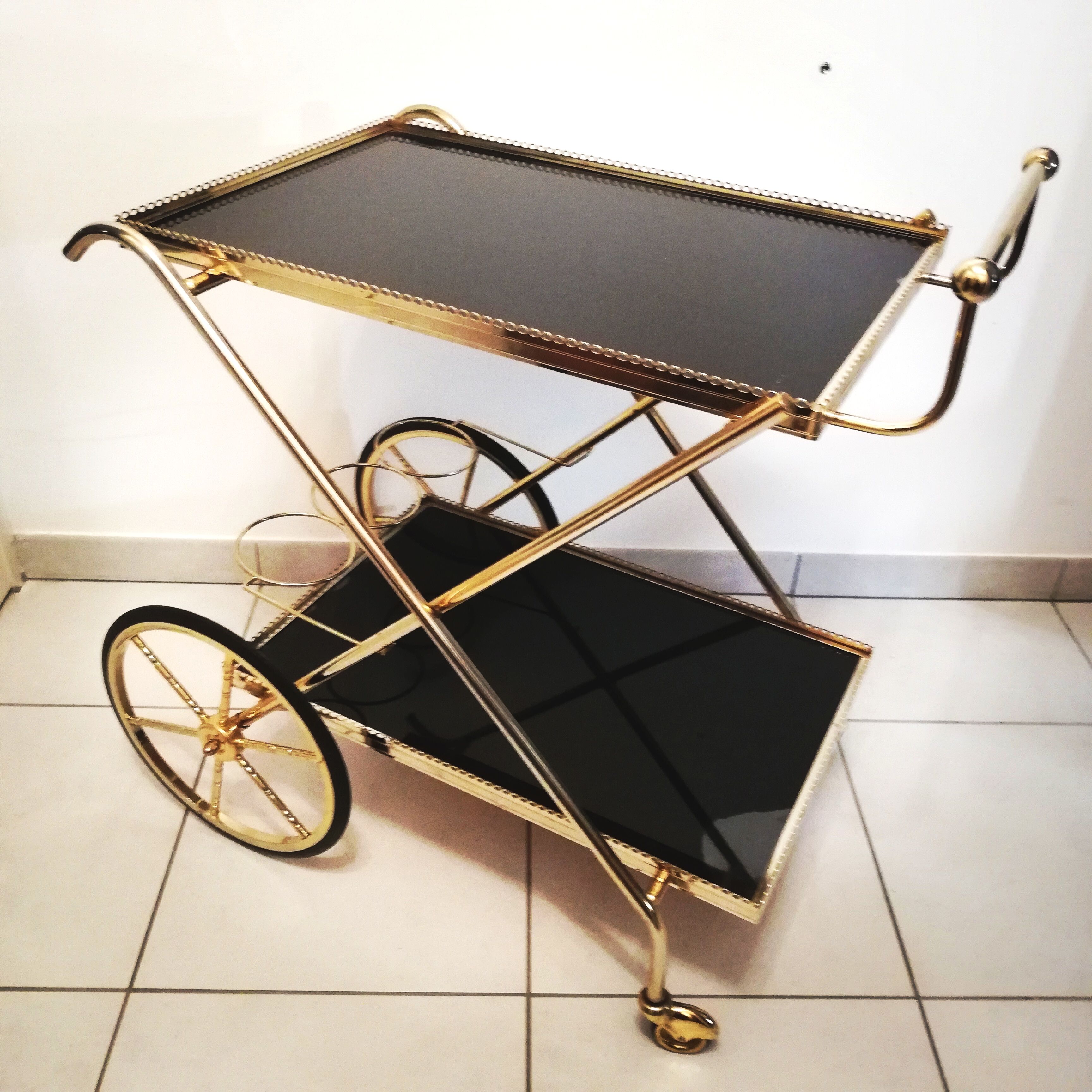 Golden brass trolley wheeled dessert and glass trays