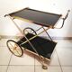 Golden brass trolley wheeled dessert and glass trays