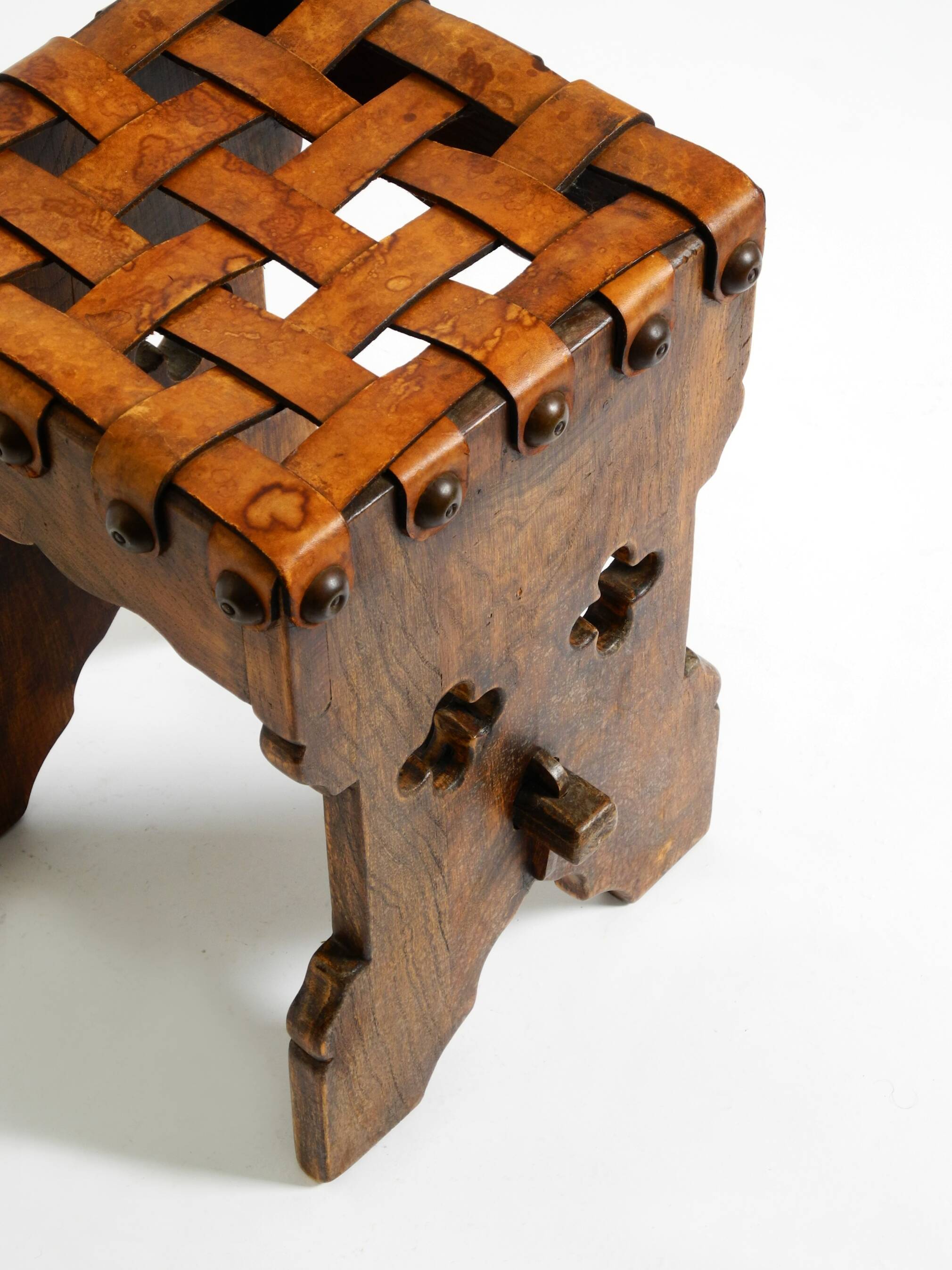 Beautiful 1940s oak stool with a seat made of leather straps
