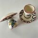Pair of HB Quimper egg cups with integrated pedestal base, floral decoration