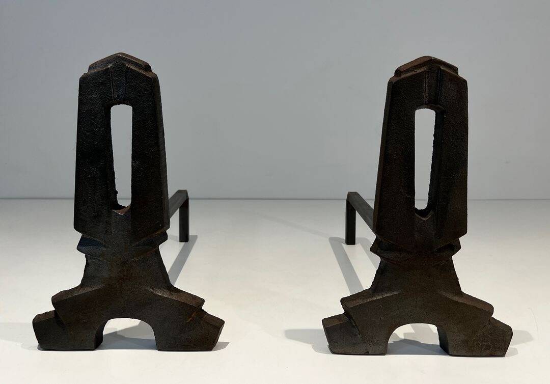 Pair of Modernist Andirons in Cast Iron with Openwork Uprights and Tripod Bases