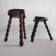 Pair of vintage tripod stools with turned wooden feet
