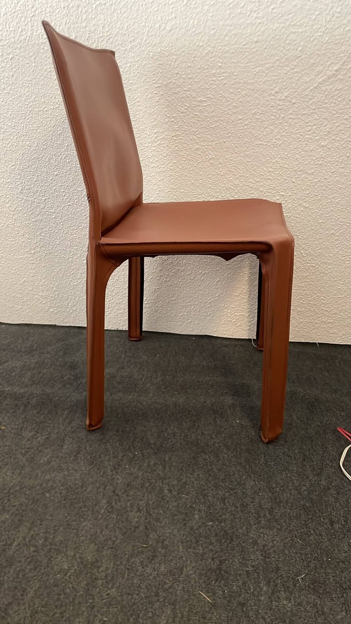Brown leather zipped chair in Bellini style, Italian design.