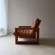 Vintage lounge chair in teak and leather from the 1960s.