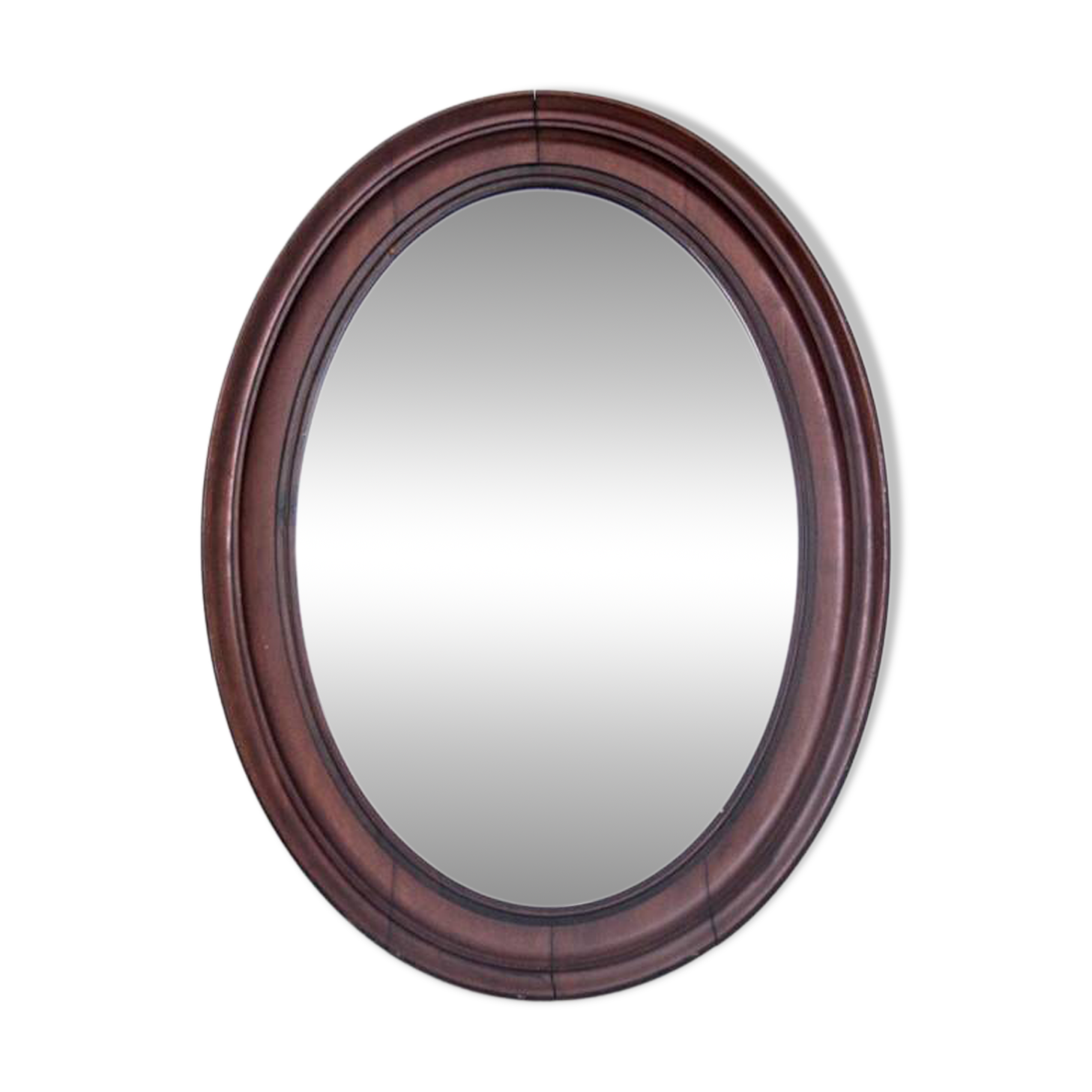 Oval mirror in a mahogany frame, Northern Europe, late 19th century.