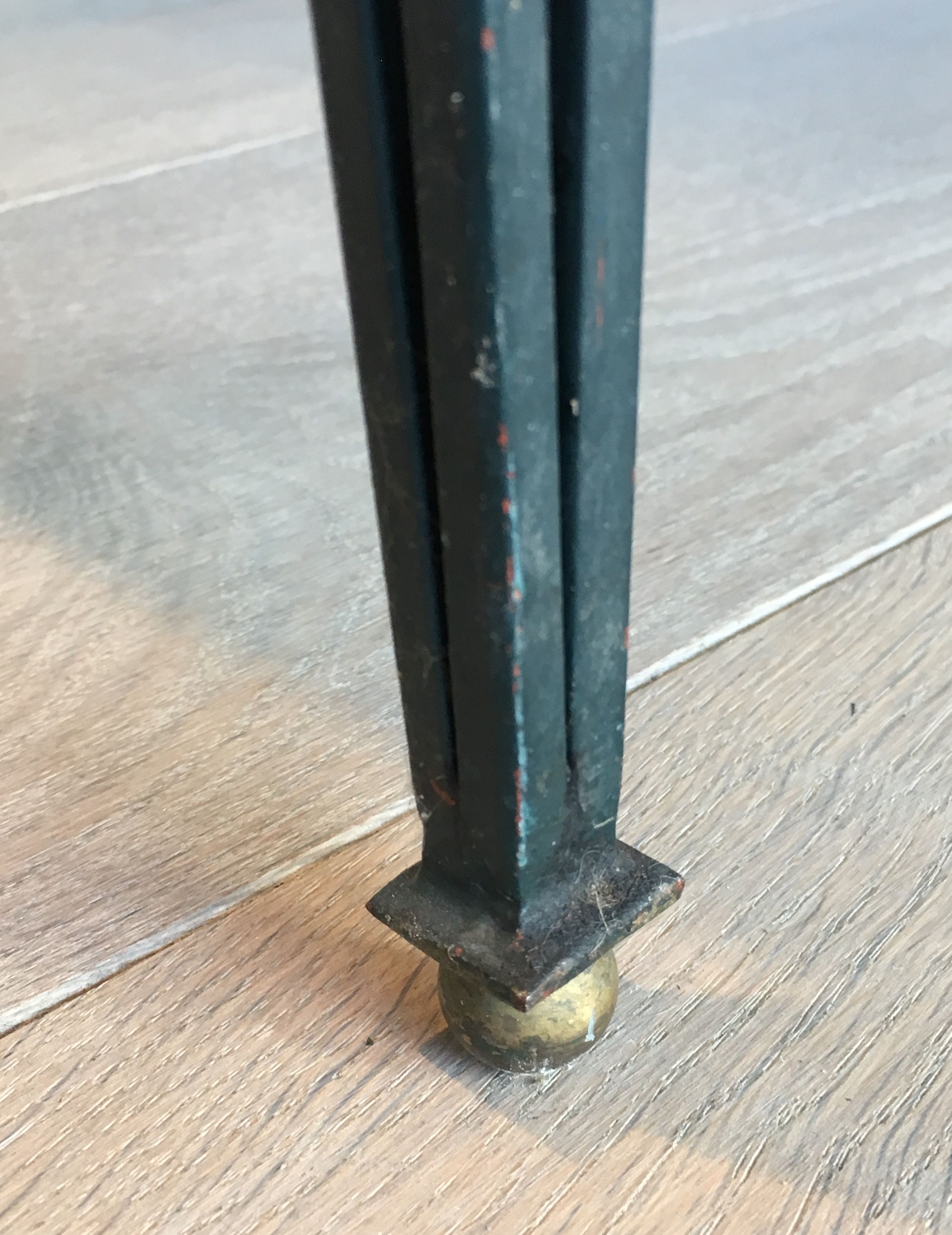 Patinated and gilded steel coffee table in the style of Jacques Quinet.