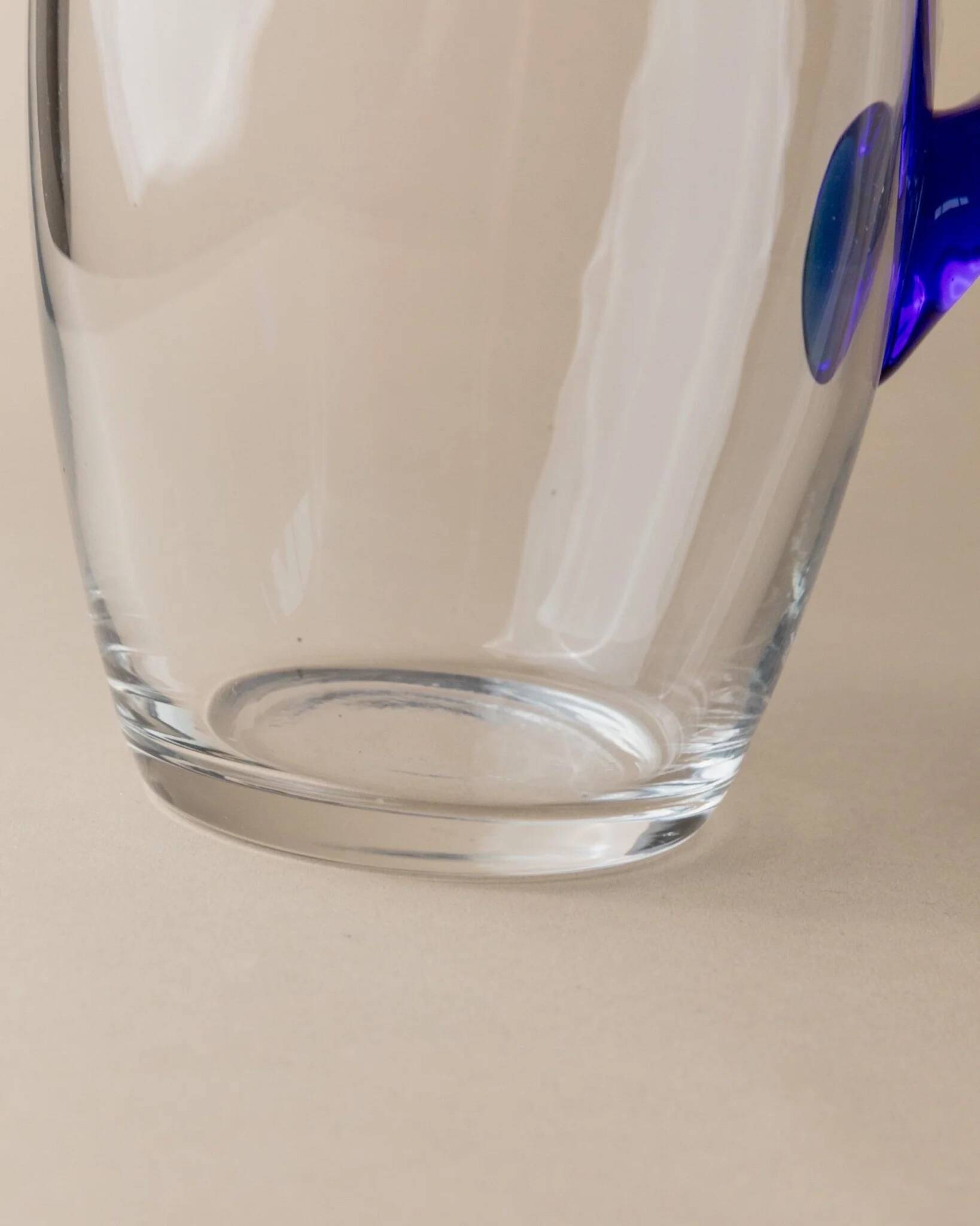 Vintage glass pitcher - clear glass with blue handle - Mid-Century design from Italy in the 1970s - elegant table decoration, retro gift idea.