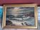 Old oil painting depicting a seascape.