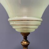 Ornate brass table lamp with mint green glass shade