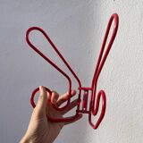 Pair of red metal wall hooks