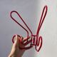 Pair of red metal wall hooks