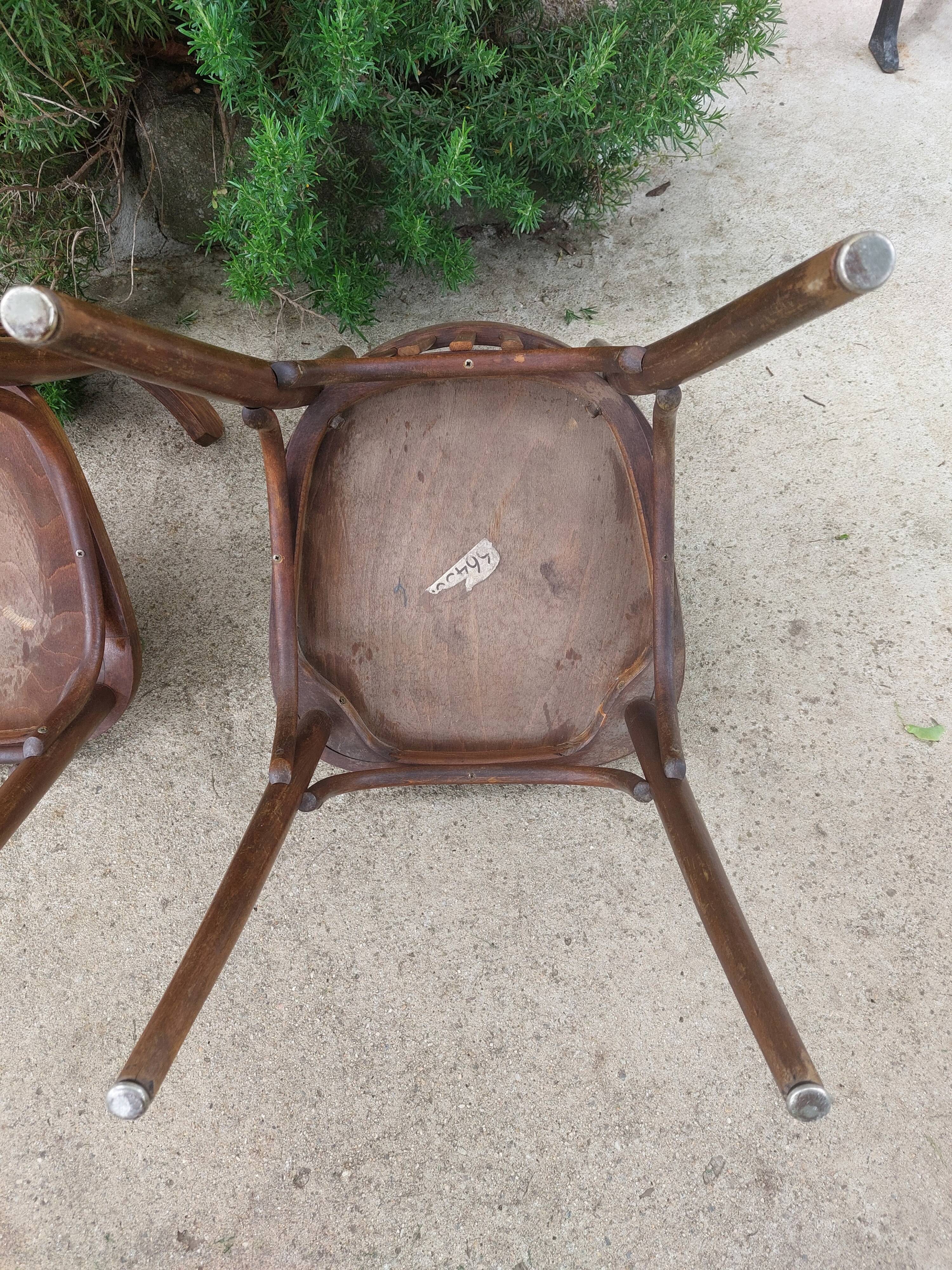pair of dark bistro chairs, rounded backs, Baumann style