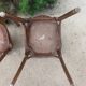 pair of dark bistro chairs, rounded backs, Baumann style