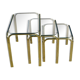 Nested tubular tables in gold metal.