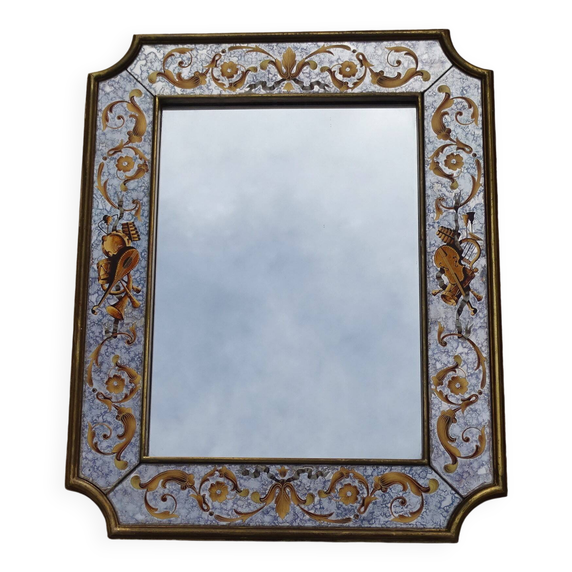50s Eglomisé glass mirror with musical instrument decor