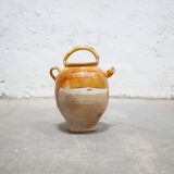 Old gargoulette pot in glazed terracotta