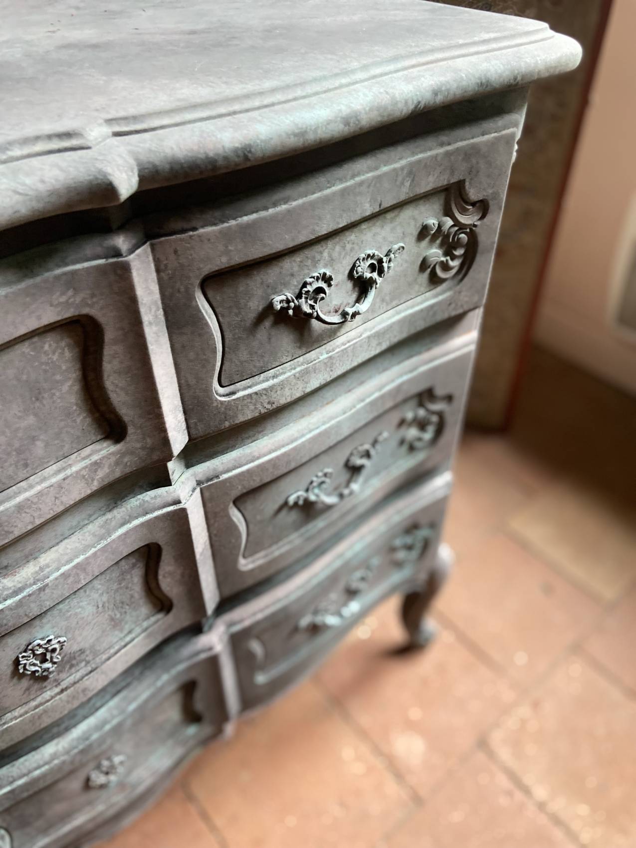 Antique Louis XV style commode, aged finish, practical elegance.