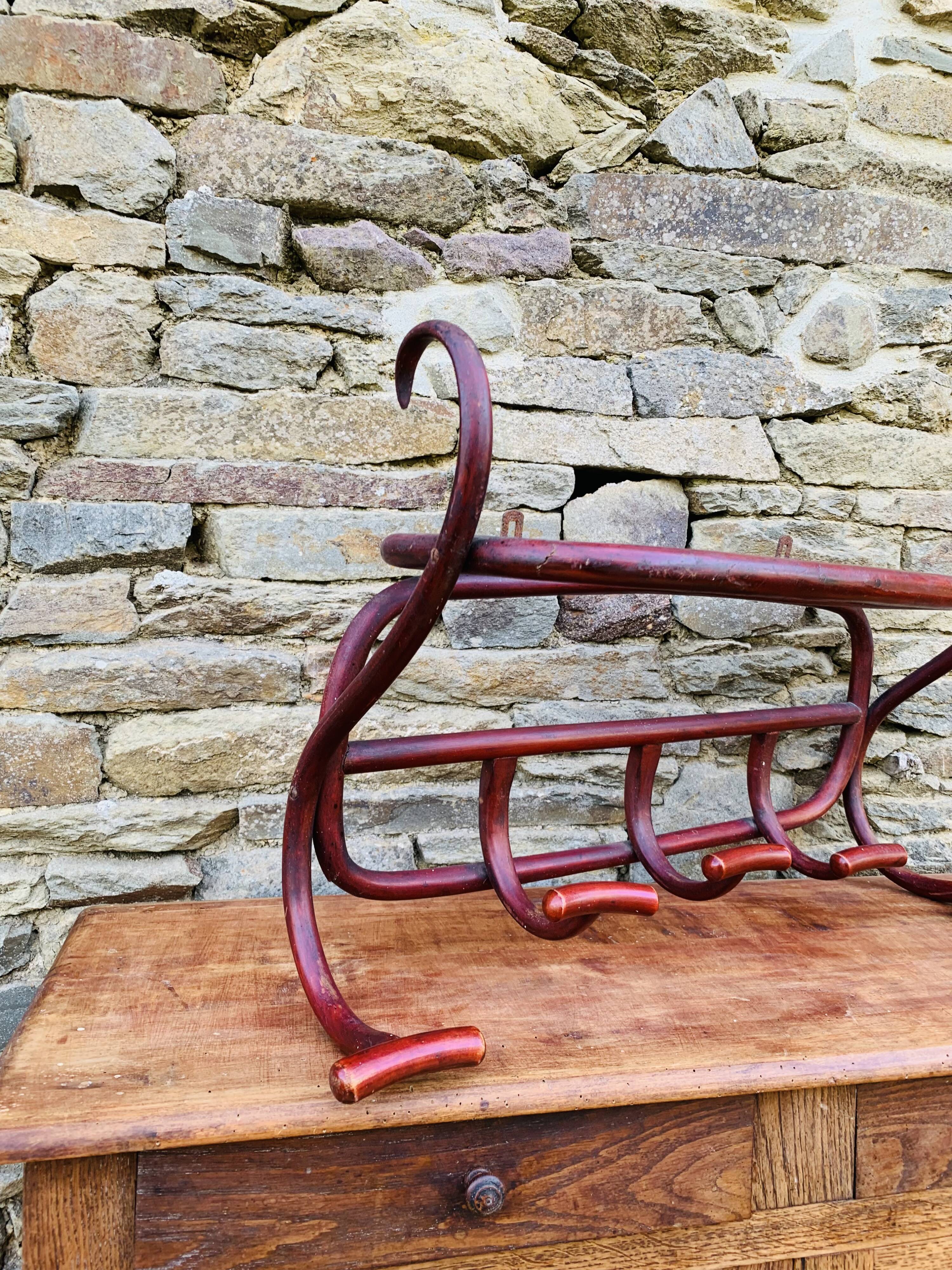 Antique curved wooden wall coat rack
