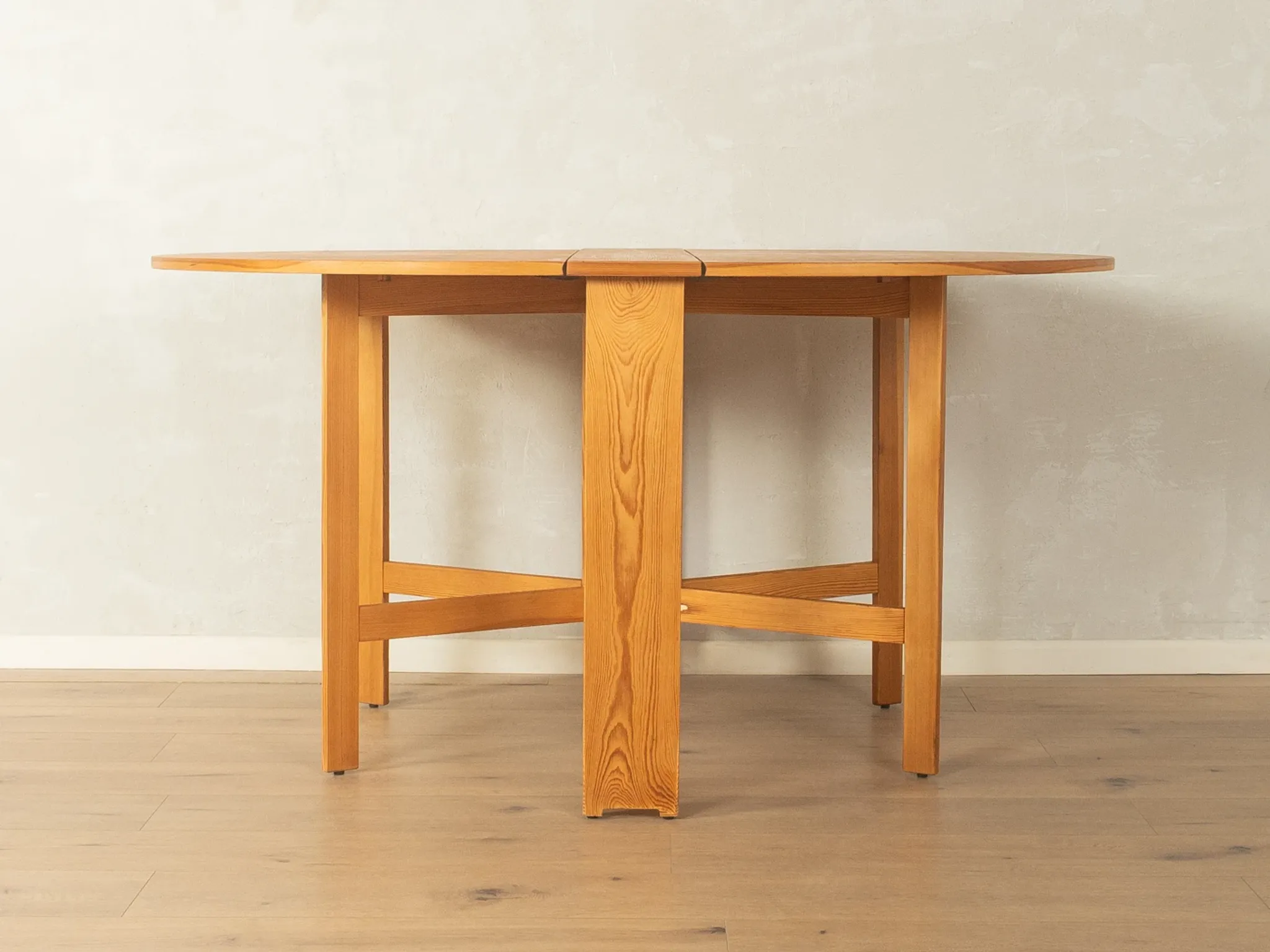 Practical folding table from the 1980s made of light brown pine wood