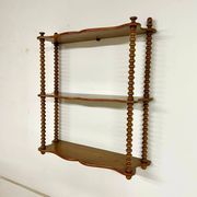 Vintage turned wood wall shelf with 3 levels.