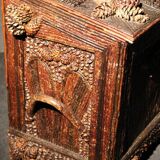 Furniture trunk in 19th tree covered with pine cones tree branches