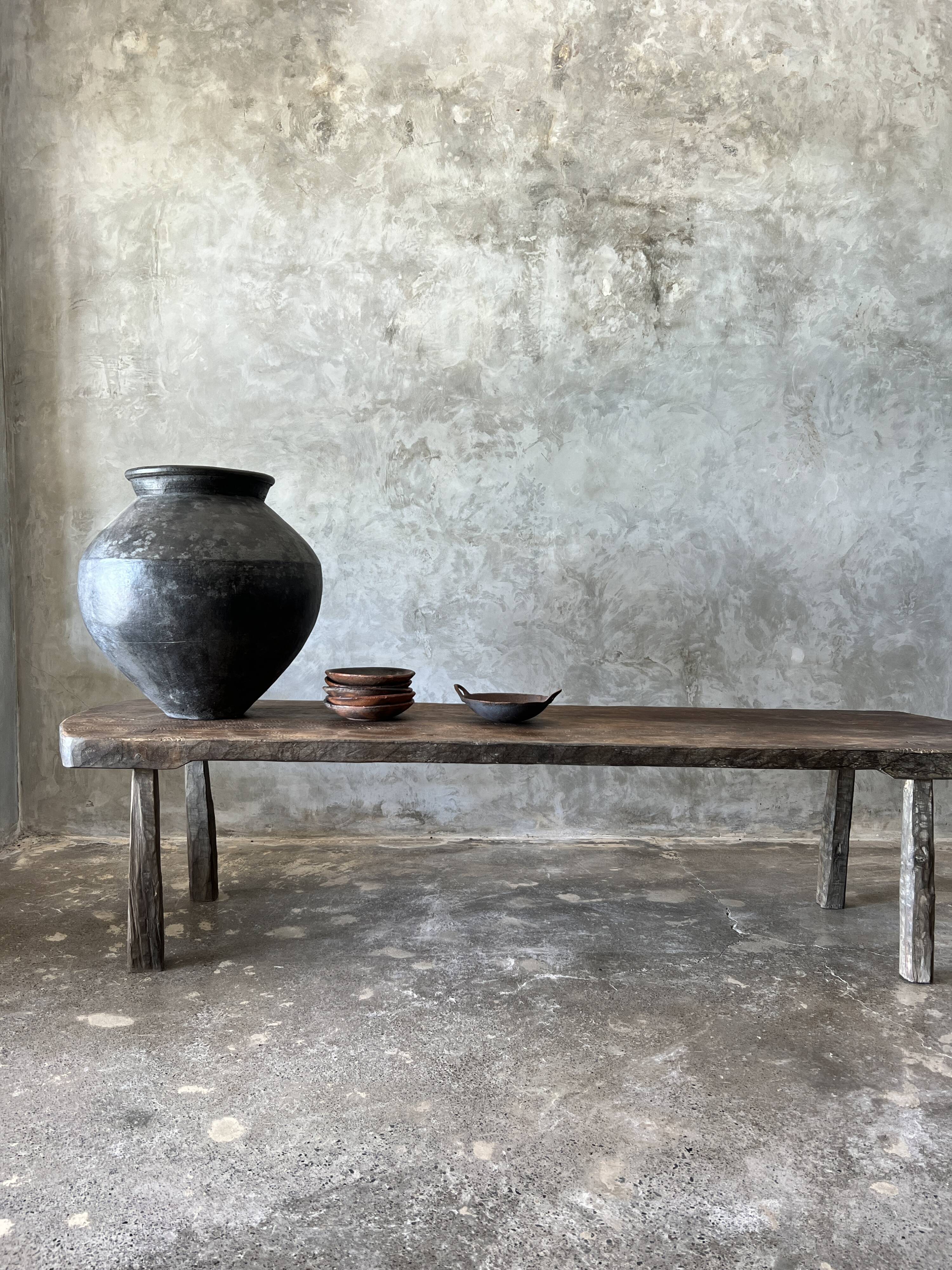 Large rounded coffee table in old Asian teak