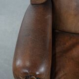 Warm, cosy and comfortable vintage sheepskin ear armchair with character