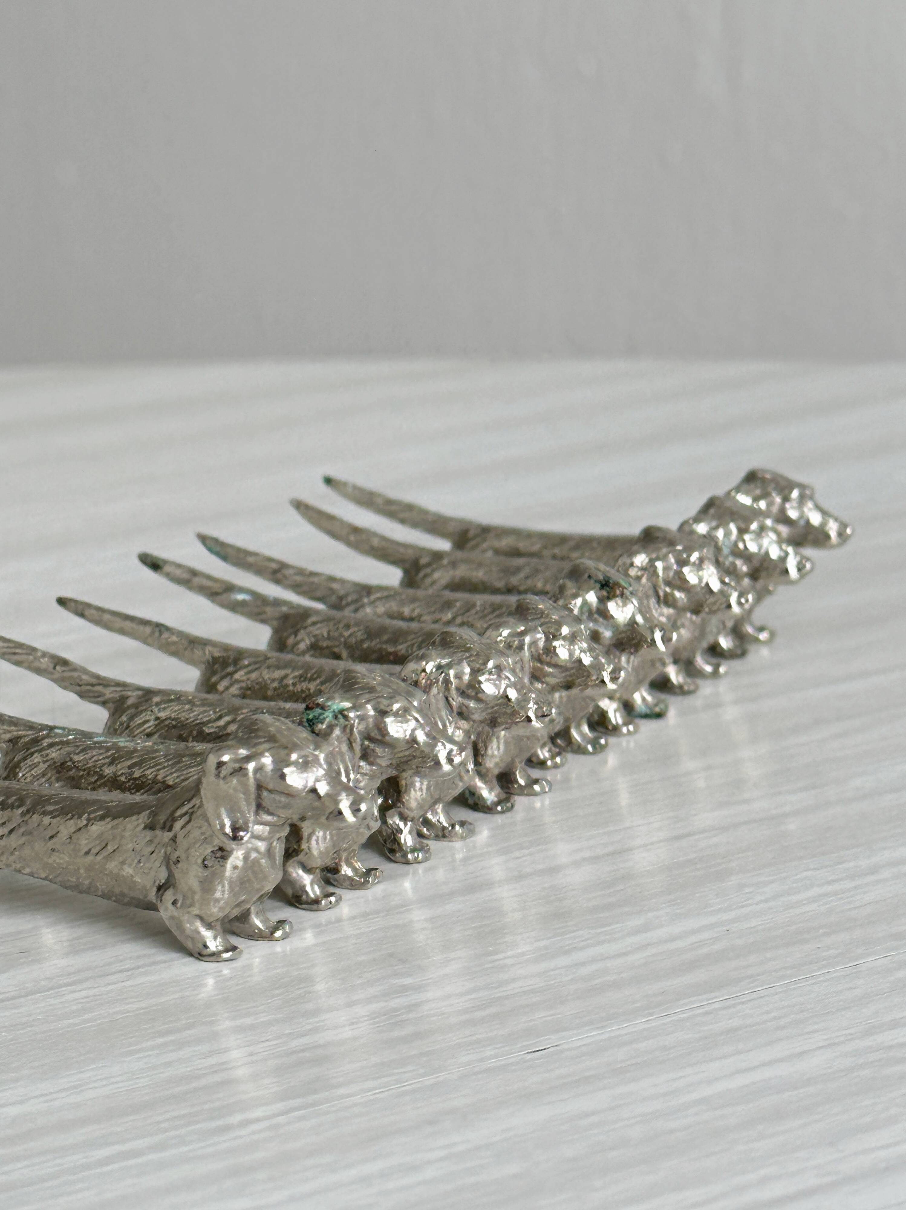 Set of 8 dachshund-shaped knife rests