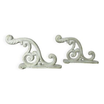 Pair of cast iron coat hooks from the 19th century.