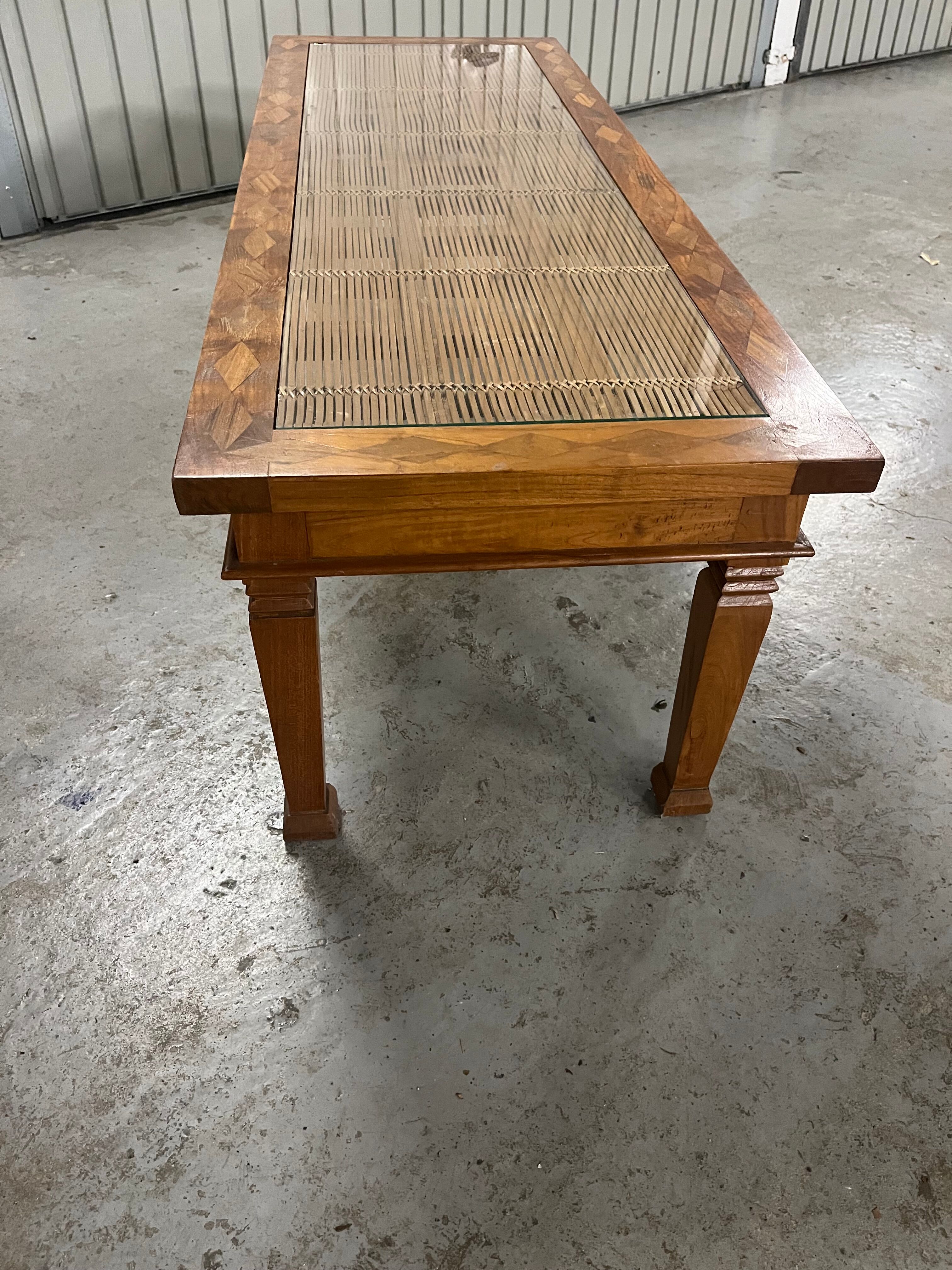 Colonial style teak coffee table - bamboo top under glass