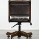 Chesterfield office chair in English style made of cow leather and wood.