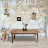 Vintage farmhouse table with turned legs.