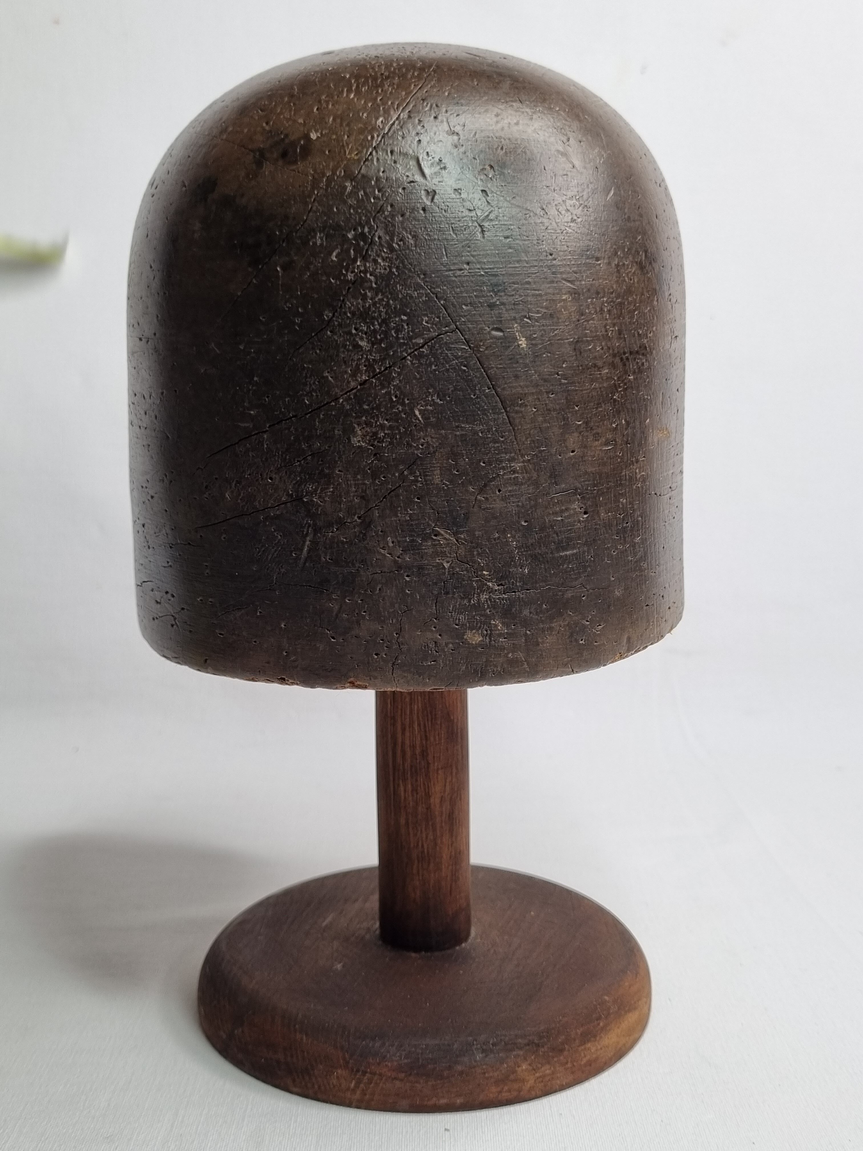Old solid wood hat shape on foot, 1900