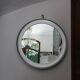Large round brushed metal mirror by Sergio Mazza for Artemide, 1960s-70s.
