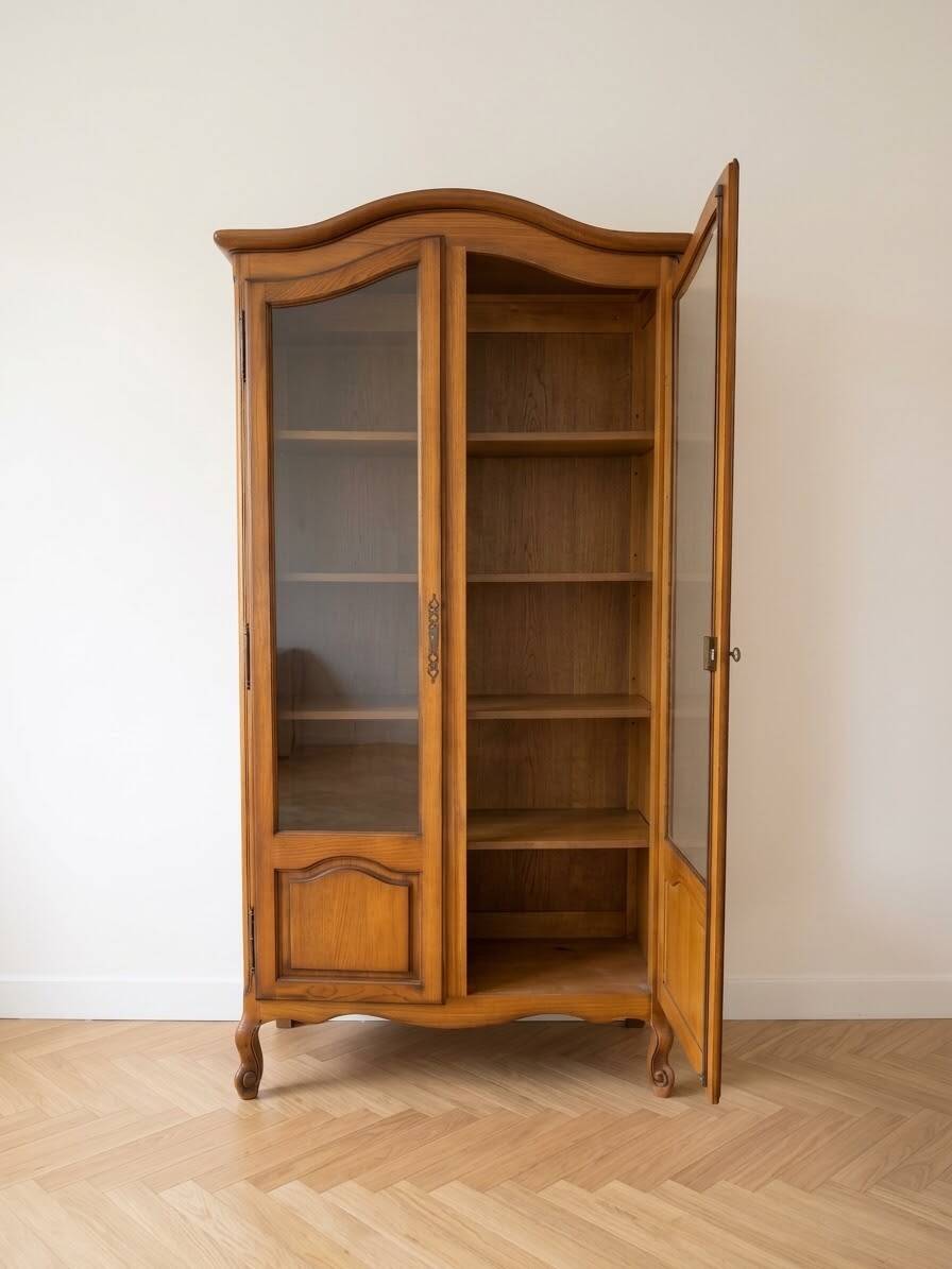 Antique wooden display cabinet with glass doors.